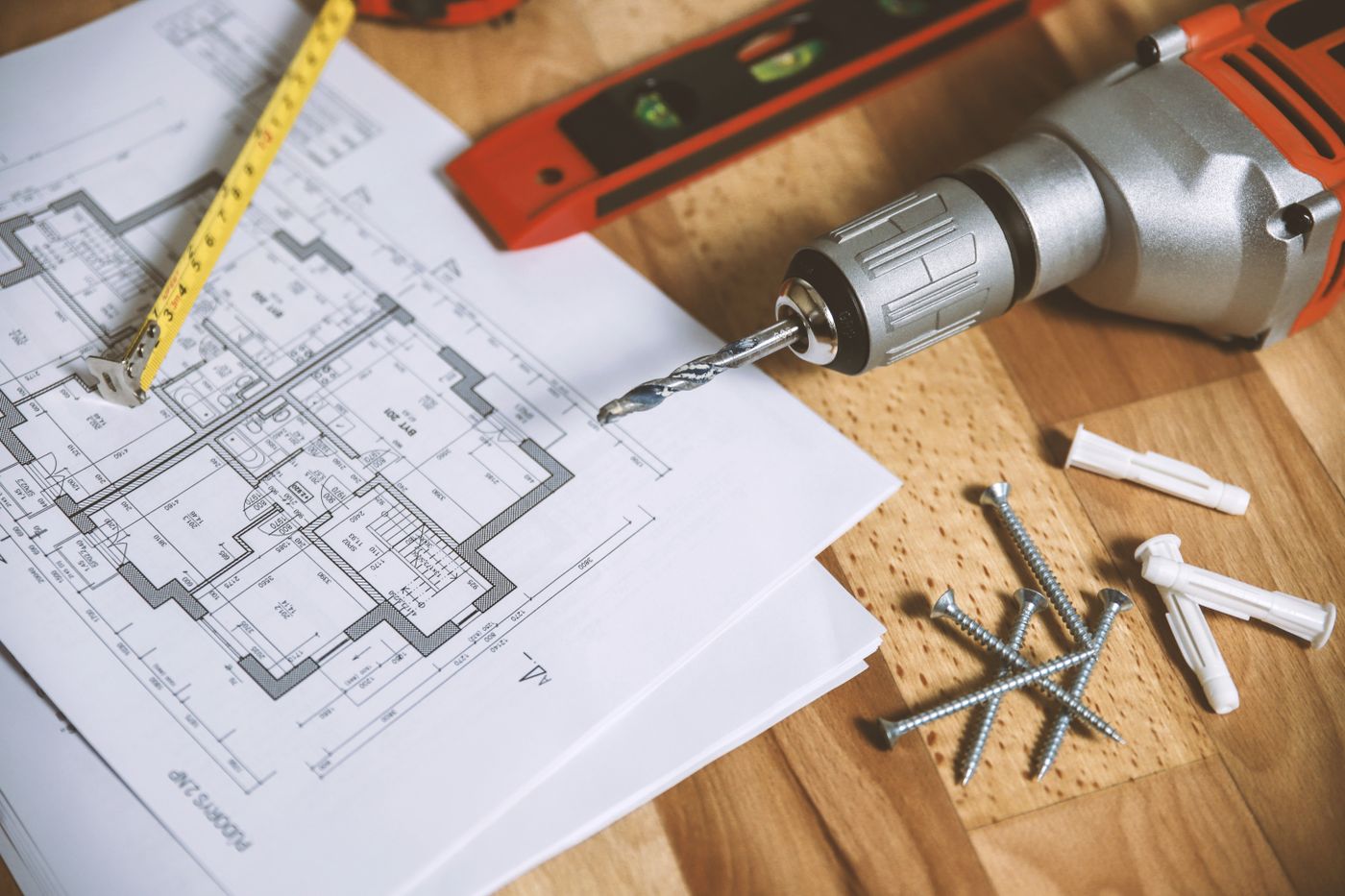 House plans, tape measure and spirit level